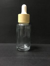 Bottiglia trasparente del contagoccia del vetro da bottiglia dell'olio essenziale 30ml con l'imballaggio di plastica di Skincare del cappuccio