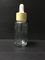 Bottiglia trasparente del contagoccia del vetro da bottiglia dell'olio essenziale 30ml con l'imballaggio di plastica di Skincare del cappuccio