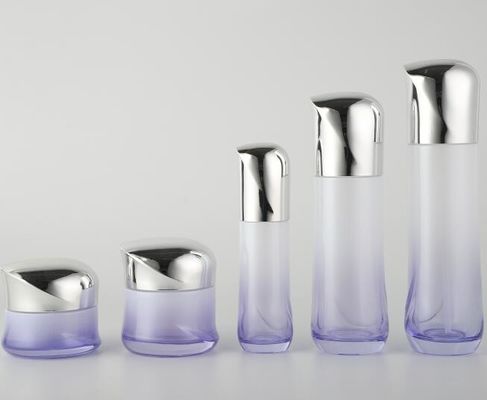 Le bottiglie cosmetiche di vetro di lusso con i coperchi/la lozione placcati barattolo della crema imbottiglia l'imballaggio cosmetico