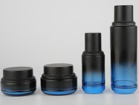 Contenitori di vetro d'imballaggio di cura di pelle del barattolo della crema della bottiglia della lozione del cosmetico con il berretto nero